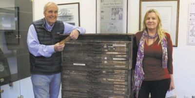 Phelps Anderson (left) and Barbara Beck show off a vintage letterpress type case cabinet, complete with its original shipping tag in Anderson’s hands. Phelps Anderson (left) and Barbara Beck show off a vintage letterpress type case cabinet, complete with its original shipping tag in Anderson’s hands.
