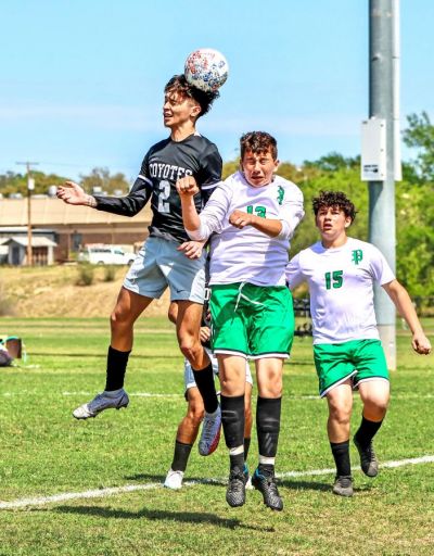 Daniel Perez (No. 2) out jumps a Pearsall player and heads the ball towards a teammate during the first half of the District 28-4A match between the Uvalde Coyotes and the Pearsall Mavericks. (March 16, 2023) (Pete Luna | Uvalde (Texas) Leader-News)