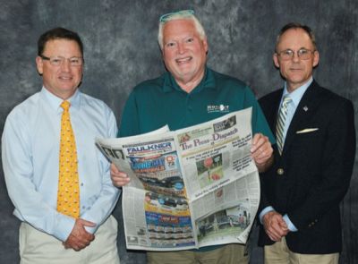 Don Hurd, president of Heartland Communications, stands with Press-Dispatch co-publishers Andy (l) and John (r) Heuring of Pike County Publishing Corp. The brothers have been involved with publishing for more than 40 years and sold The Press-Dispatch and South Gibson Star-Times in Fort Branch to Heartland on Sept. 1.